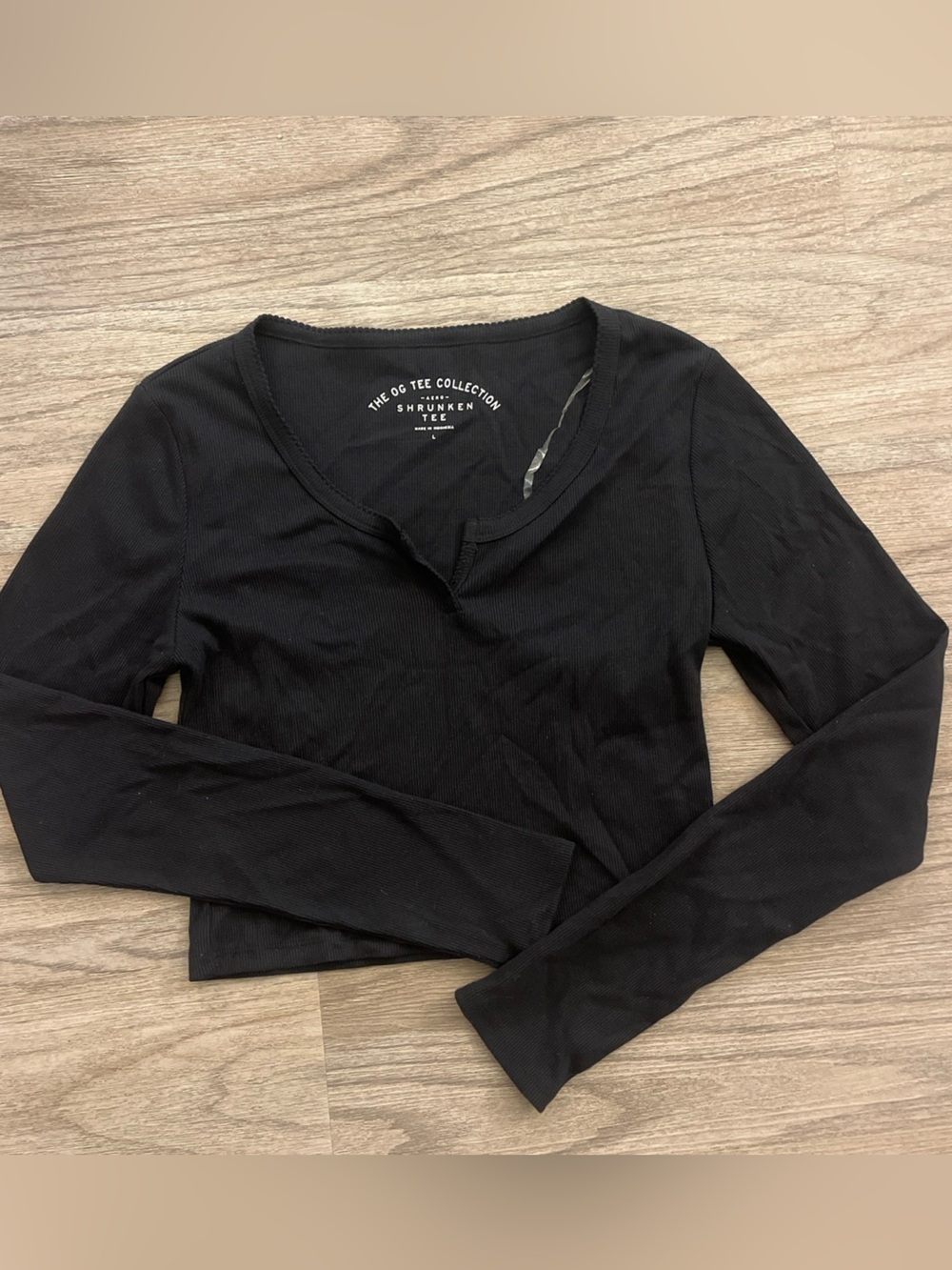 Black Long Sleeve Ribbed cropped Top Size large But fits like a Medium